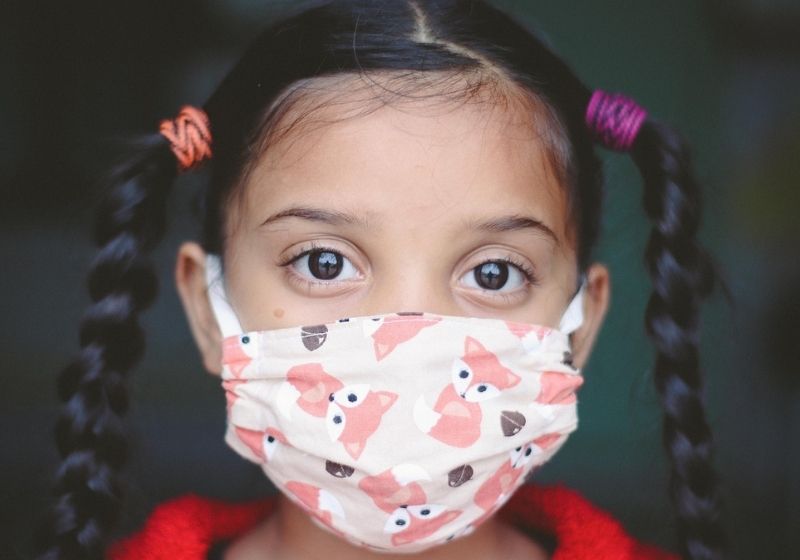 child in a mask
