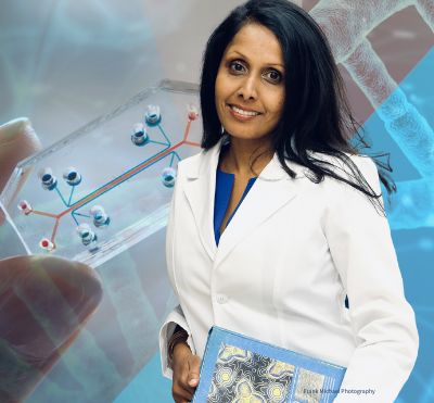 Dr. Charu Chandrasekera in front of a background of dna strands and an organ-on-a-chip