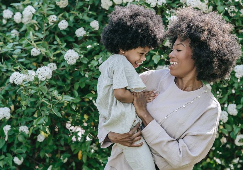 Image of mother holder her child and smiling