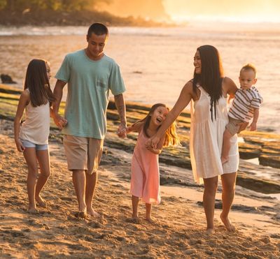 Image of a family walking on a beach