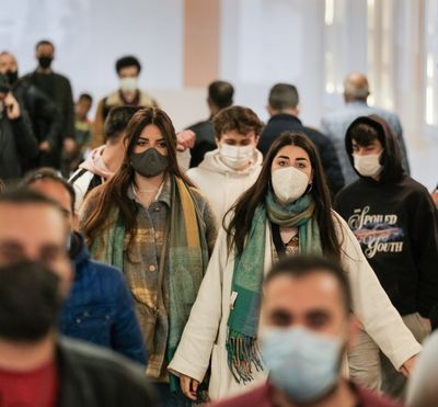 Image of a crowd of people wearing masks