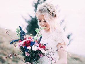 young girl in a bridal-type dress holding flowers--we need to end child marriage