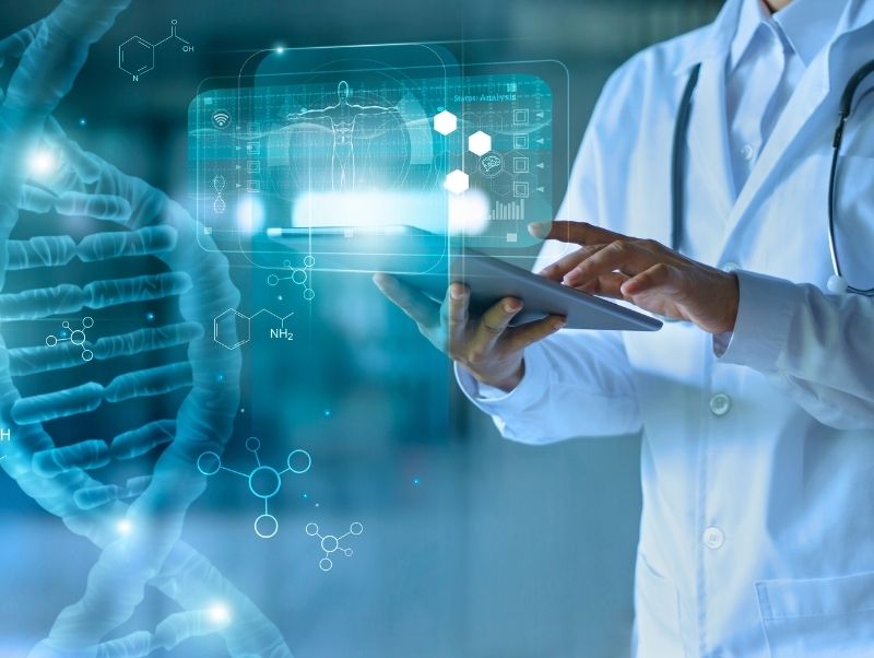 Image of a doctor in a lab coat working on a tablet, and other medical-related elements in the background and foreground, such as a magnified strand of DNA.